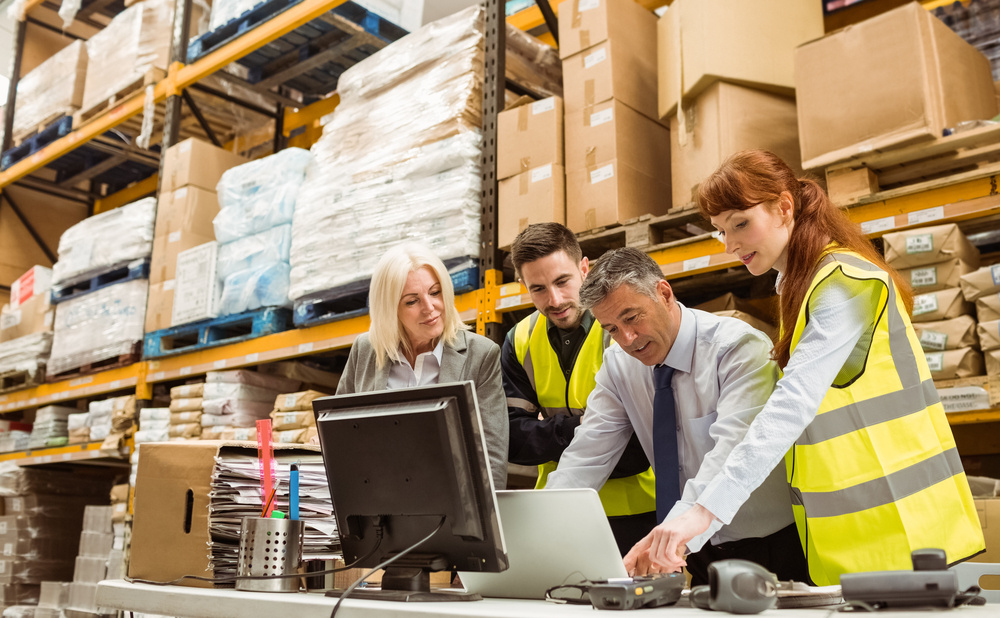 Warehouse managers and worker talking in a large warehouse-2